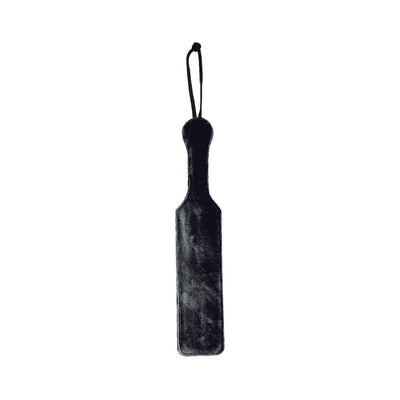 Black leather paddle with soft black faux fur side and wrist strap for secure grip.