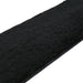 Close-up of a black leather paddle with soft black faux fur surface for dual-texture sensation.