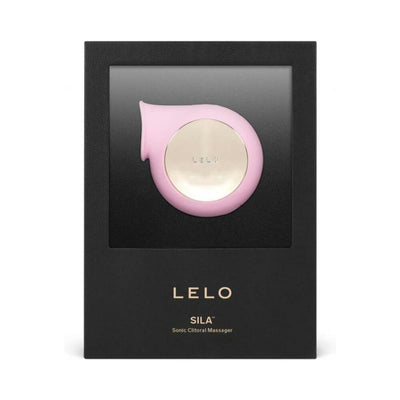 Lelo Sila Cruise sonic clitoral massager in pink with gold center, displayed in black branded packaging.