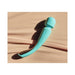 Lelo Smart Wand 2 Large in turquoise with ergonomic curved design resting on a beige surface with soft shadows.