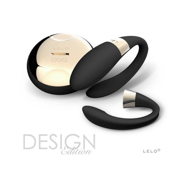 Lelo Tiani 2 black silicone couples massager with gold-accented wireless remote on white background