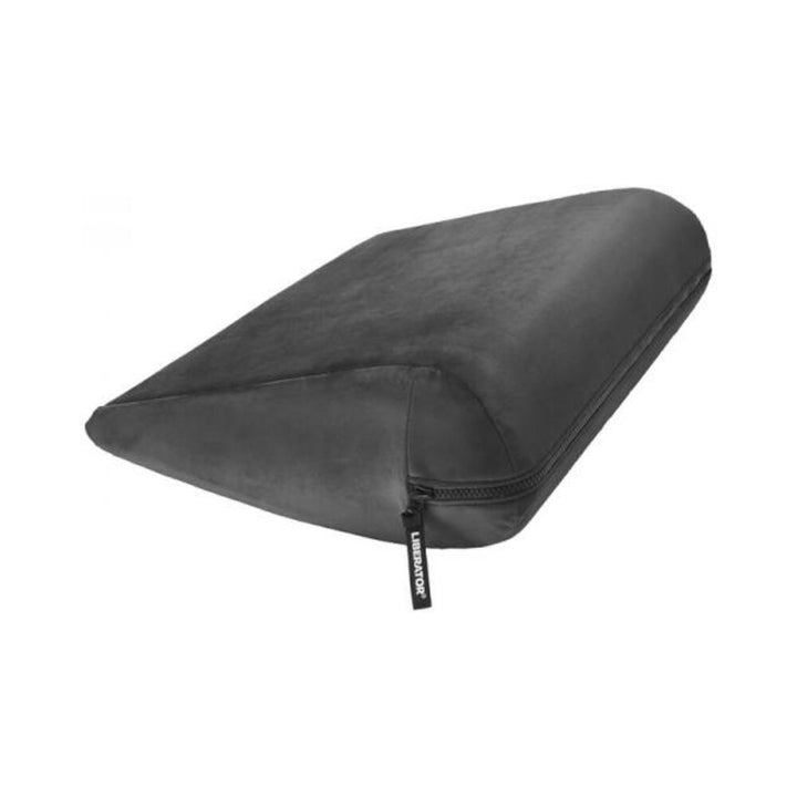Black velvet wedge-shaped positioning aid pillow with a zipper and Liberator branded pull tab.