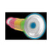 Rainbow-colored silicone dildo with a strong suction base glowing in the dark against a black background.