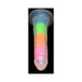 Rainbow glow-in-the-dark silicone dildo with suction base and vibrant multicolor design against black background.