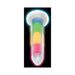 Rainbow-colored silicone dildo glowing in the dark with a strong suction base against a black background.