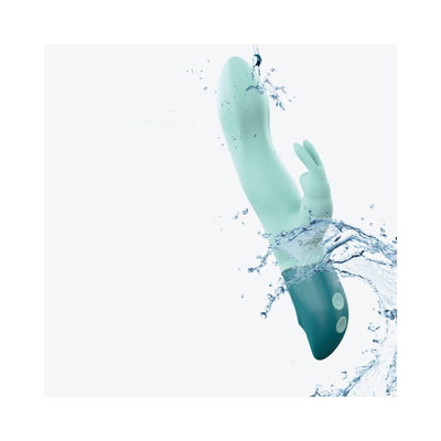 Mint green waterproof rabbit vibrator with flexible ears and ergonomic handle splashed with water.