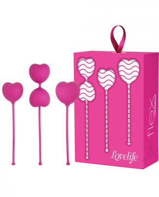 Set of three pink silicone heart-shaped kegel weights with retrieval cords and matching pink packaging box.