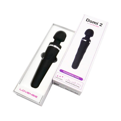 Lovense Domi 2 black wand vibrator displayed in white packaging with product box showing programmable wand features.