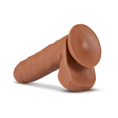 Realistic mocha-colored dildo with suction cup base and detailed texture for hands-free use and harness compatibility.