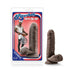 Chocolate-colored realistic textured adult toy with suction base next to its Loverboy Pierre the Chef packaging.