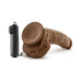 Mocha-colored 9-inch realistic vibrating dildo with suction base and black remote control on white background.