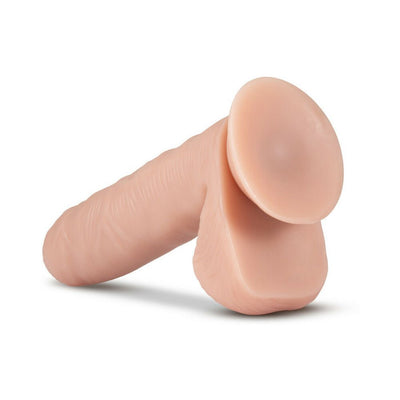 Realistic vanilla-colored silicone adult toy with suction cup base and lifelike texture.