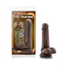 Chocolate-colored realistic dildo with suction cup base next to Loverboy Top Gun Tommy packaging featuring illustrated character.
