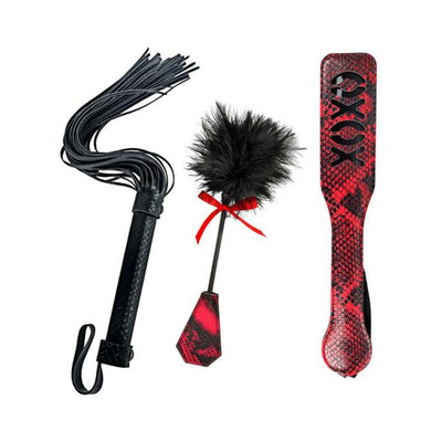 Lovers Kits set with black faux leather whip, red and black snake print paddle, and feather tickler with red bow.