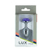 Lux Active metal butt plug with a purple rose base displayed in retail packaging.