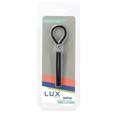 Lux Active Tether adjustable black silicone cock tie in clear retail packaging with branded label.