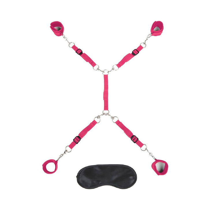 Hot pink 7-piece adjustable bed restraint system with soft cuffs and a black blindfold for playful bondage.