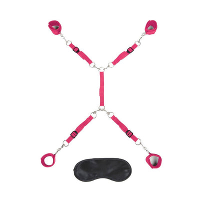 Hot pink 7-piece adjustable bed restraint system with soft cuffs and a black blindfold for playful bondage.