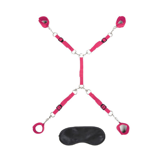 Hot pink 7-piece adjustable bed restraint system with soft cuffs and a black blindfold for playful bondage.
