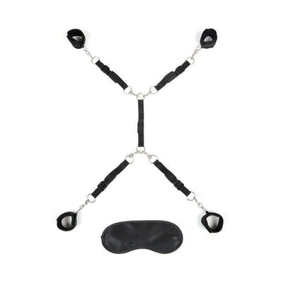 Black adjustable 7-piece bed spreader restraint system with padded cuffs and matching blindfold.