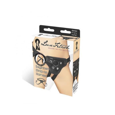 Packaging of Lux Fetish Beginners Strap On Harness in black with adjustable straps shown on a model's hips.