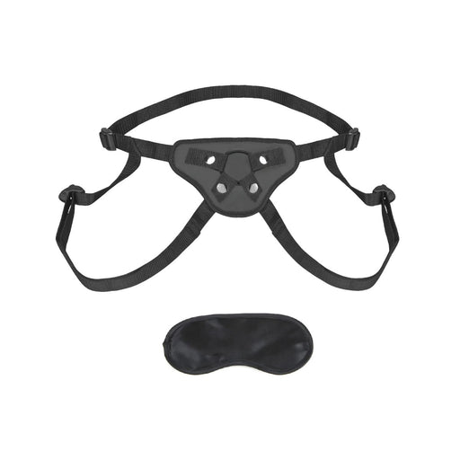 Black adjustable strap-on harness with four attachment points and matching black satin blindfold on white background.