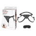 Black adjustable strap-on harness with satin blindfold and product packaging on white background.