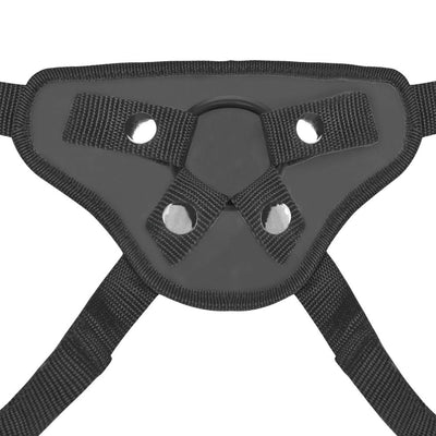 Close-up of adjustable black strap-on harness with metal snaps and O-ring for secure attachment.