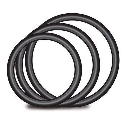 Set of four black silicone O-rings in varying sizes for strap-on harness compatibility and secure fit.