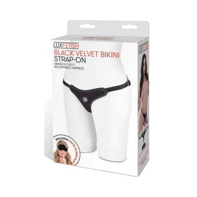Packaging of the Black Velvet Bikini Strap-On harness displayed on a mannequin torso with included satin blindfold shown.