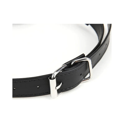Close-up of black adjustable strap with silver buckle and holes for secure fitting.