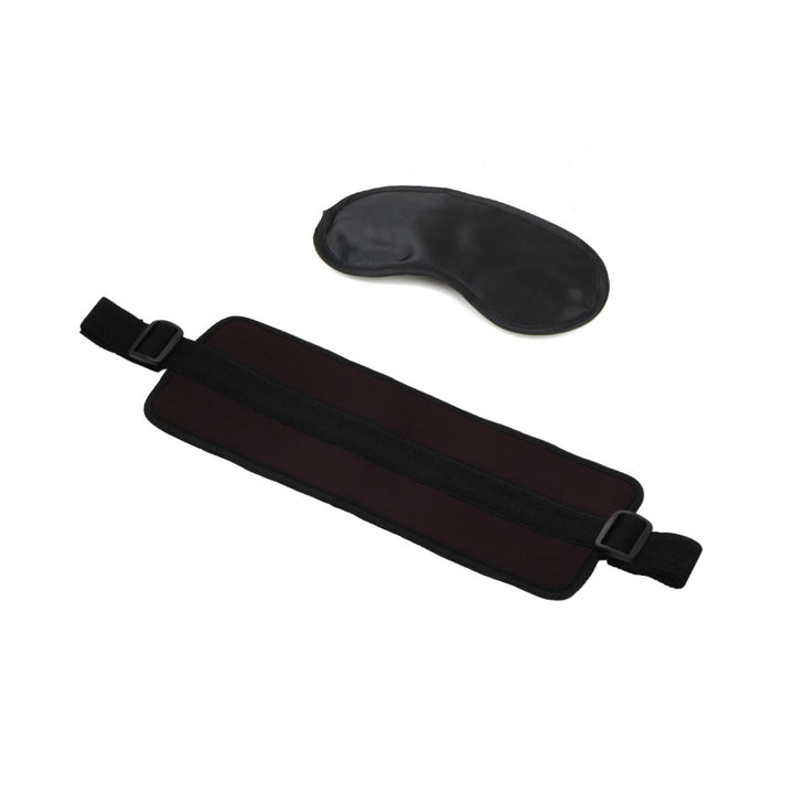 Black adjustable padded doggy style support sling with matching black satin blindfold on white background