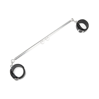 Expandable metal spreader bar with detachable black leatherette cuffs and adjustable rings on a white background