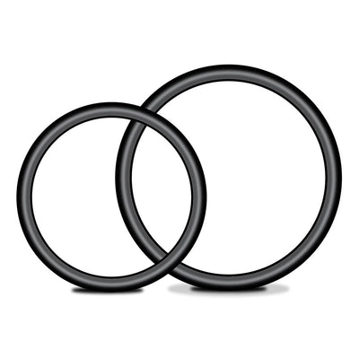 Two black silicone cock rings of different sizes on a white background.