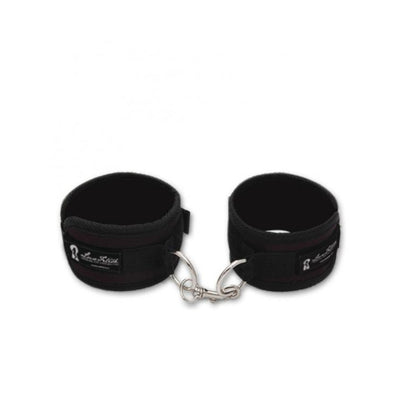 Black Lux Fetish soft padded love cuffs connected by a metal clasp for comfortable restraint.