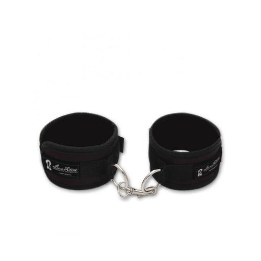 Black Lux Fetish soft padded love cuffs connected by a metal clasp for comfortable restraint.