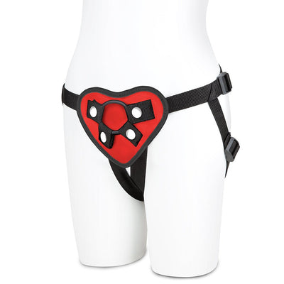 Red heart-shaped strap on harness with adjustable black straps displayed on a white mannequin.