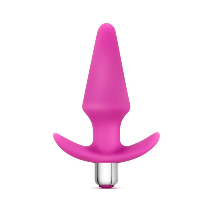 Pink silicone anal plug with ergonomic handle and removable silver bullet vibrator on white background.