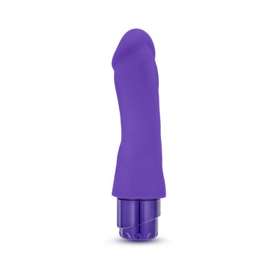 Purple silicone G-spot vibrator with curved shaft and textured head, featuring a twist dial base control.
