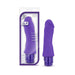 Purple realistic silicone vibrator with curved head and multi-speed control, shown with packaging and product side by side.
