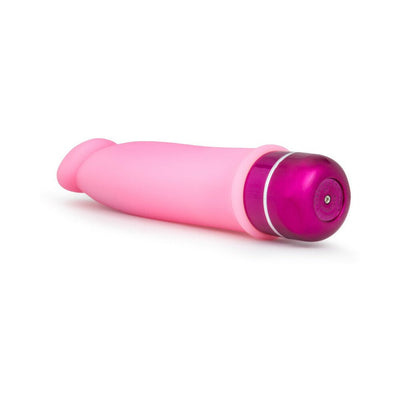 Pink silicone vibrator with a smooth texture and purple multi-speed control base on a white background.