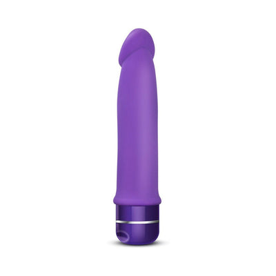 Purple silicone vibrator with smooth, curved design and multi-speed dial base, waterproof and battery-operated.