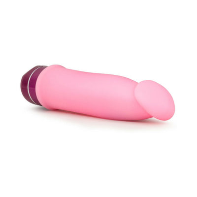 Pink silicone vibrator with a curved tip and purple multi-speed dial base on white background.