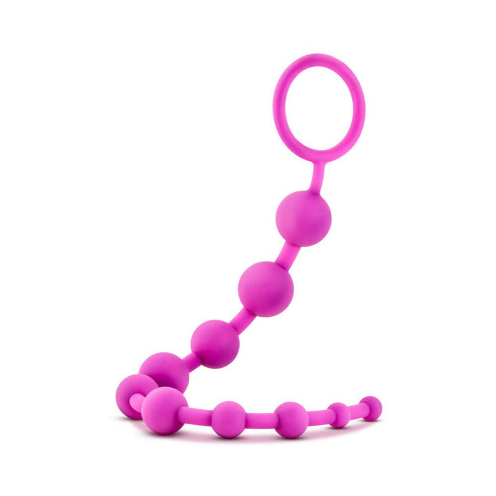 Purple silicone anal beads with 10 graduated smooth beads and a looped handle for easy retrieval.