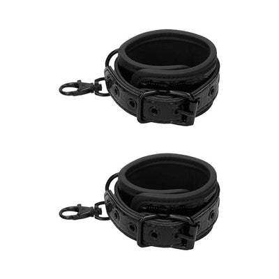 Pair of black neoprene and patent vinyl cuffs with buckles and metal clips for a luxury spreader bar.