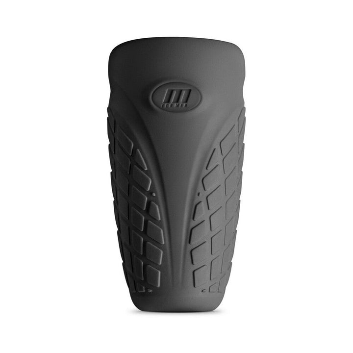 Black silicone stroker with textured grip pattern and M for Men logo on front, designed for comfort and flexibility.