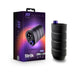 Black ribbed silicone stroker with purple control button next to its purple and black packaging box.