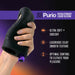 Hand holding a black textured silicone stroker with purple control button, highlighting ultra soft, silky smooth texture and optimal control features.