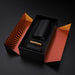 Black ribbed silicone stroker with gold bullet vibrator in sleek black and orange striped packaging box.