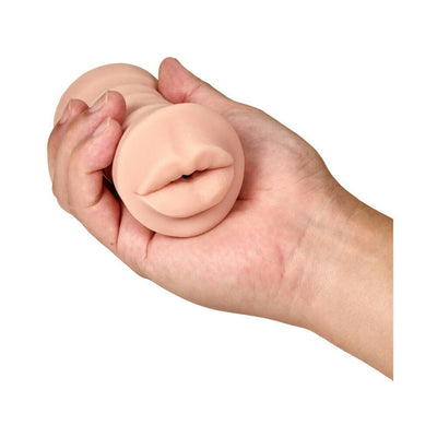 Hand holding a compact vanilla-colored realistic textured male pleasure sleeve with an open mouth design.